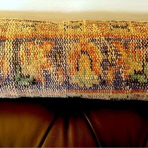 Long lumbar Turkish carpet pillow.